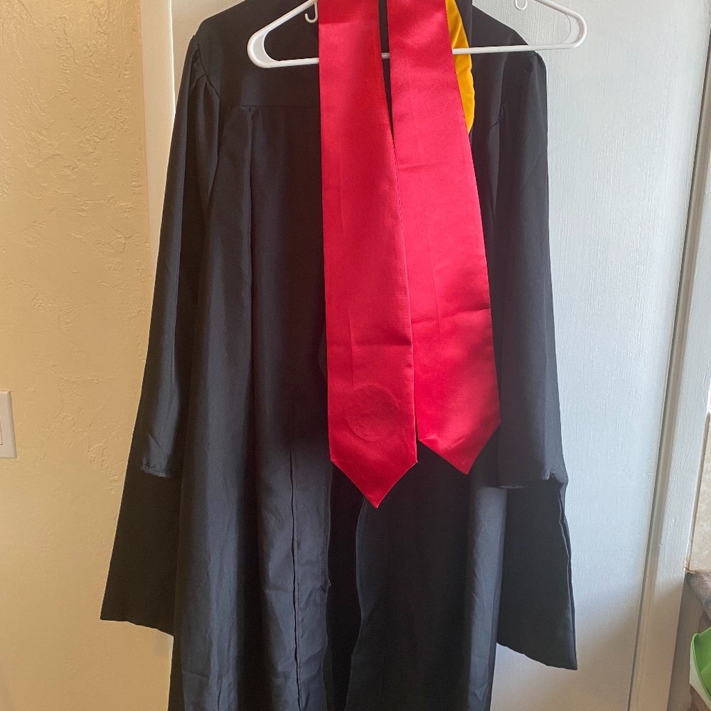 College graduation gown with tassel and cap